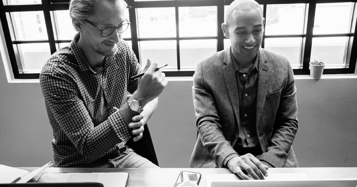 Group of diverse people having a business meeting, featured image for Search inside your product: when agents choose PostgreSQL FTS or custom search